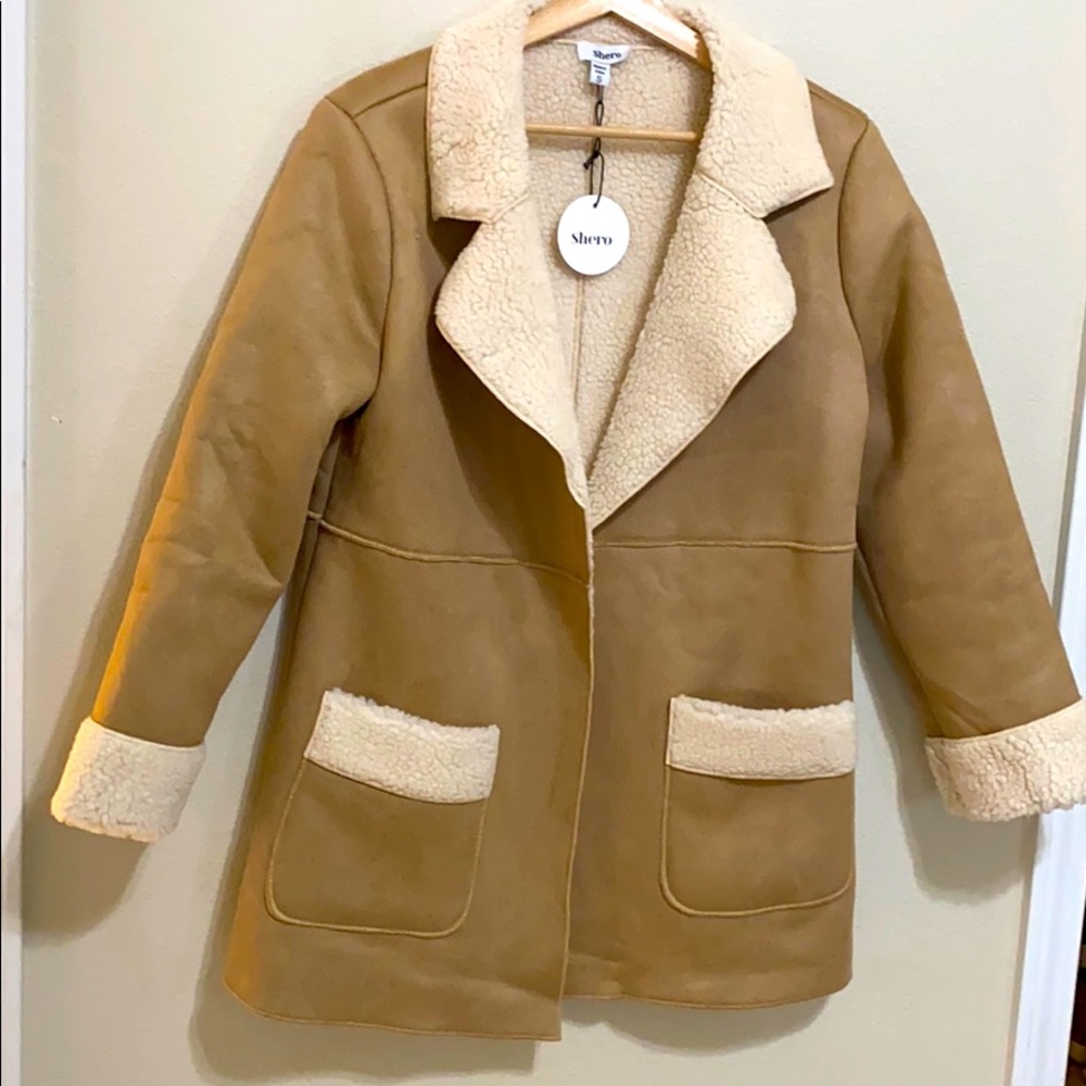 Warm perfect for winter tan over coat! Knee - mid thigh length! Never worn (: